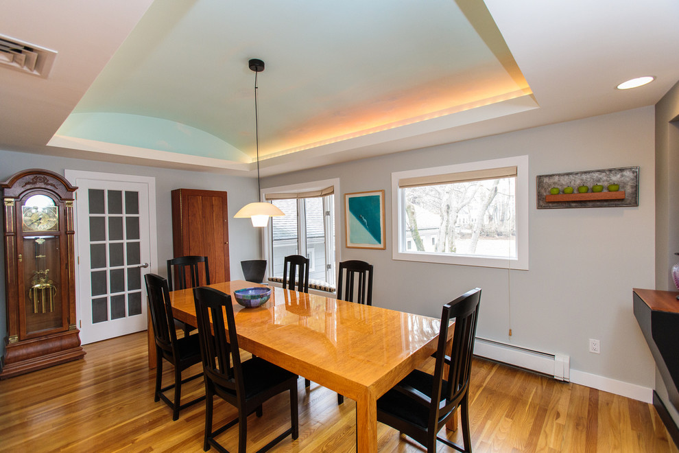 Mid-sized contemporary open plan dining in Boston with grey walls and medium hardwood floors.