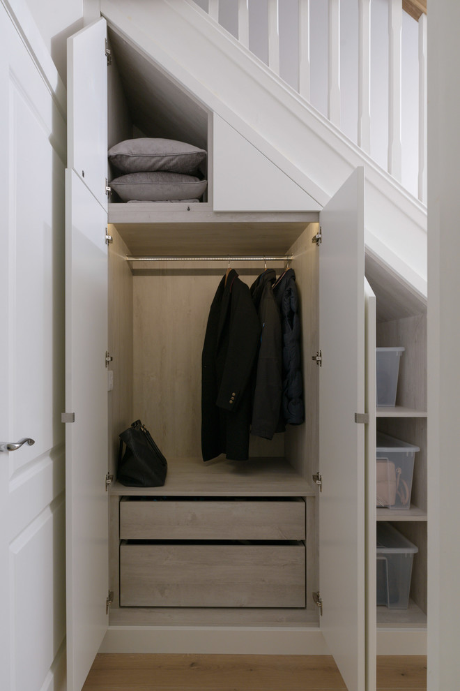 Inspiration for a transitional storage and wardrobe in Dublin.