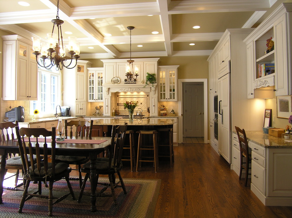 Design ideas for a traditional l-shaped eat-in kitchen in DC Metro with panelled appliances.