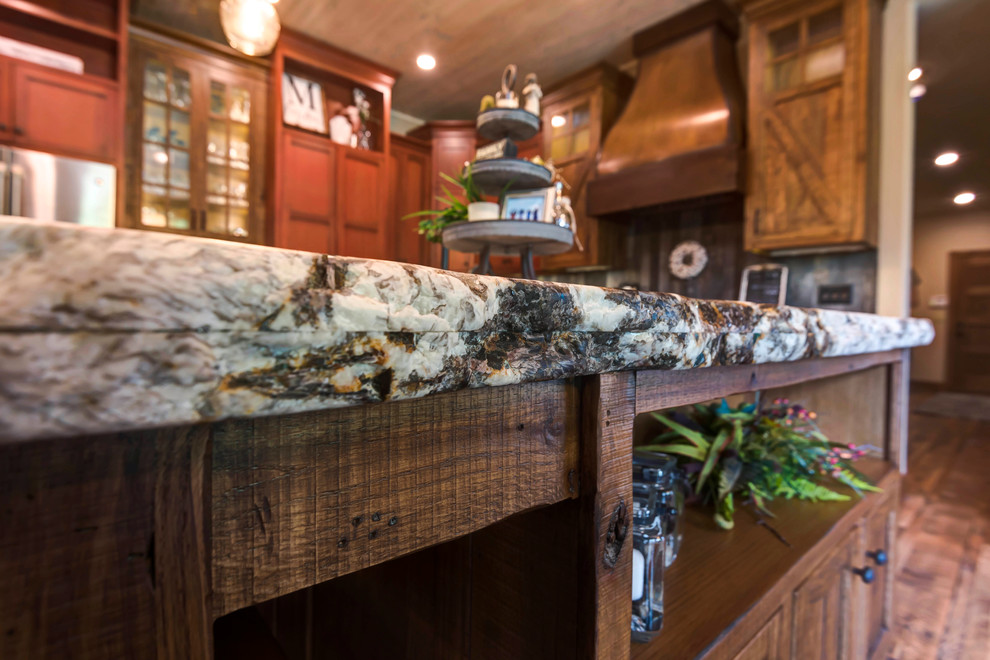 Inspiration for a large rustic kitchen remodel with shaker cabinets, medium tone wood cabinets and an island