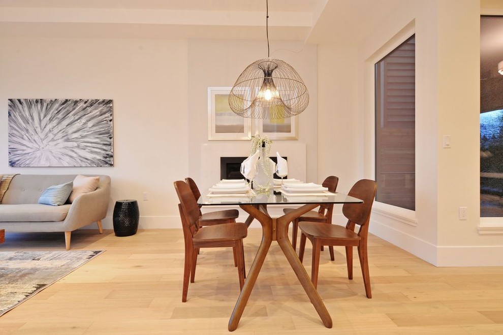 Example of a minimalist dining room design in Vancouver