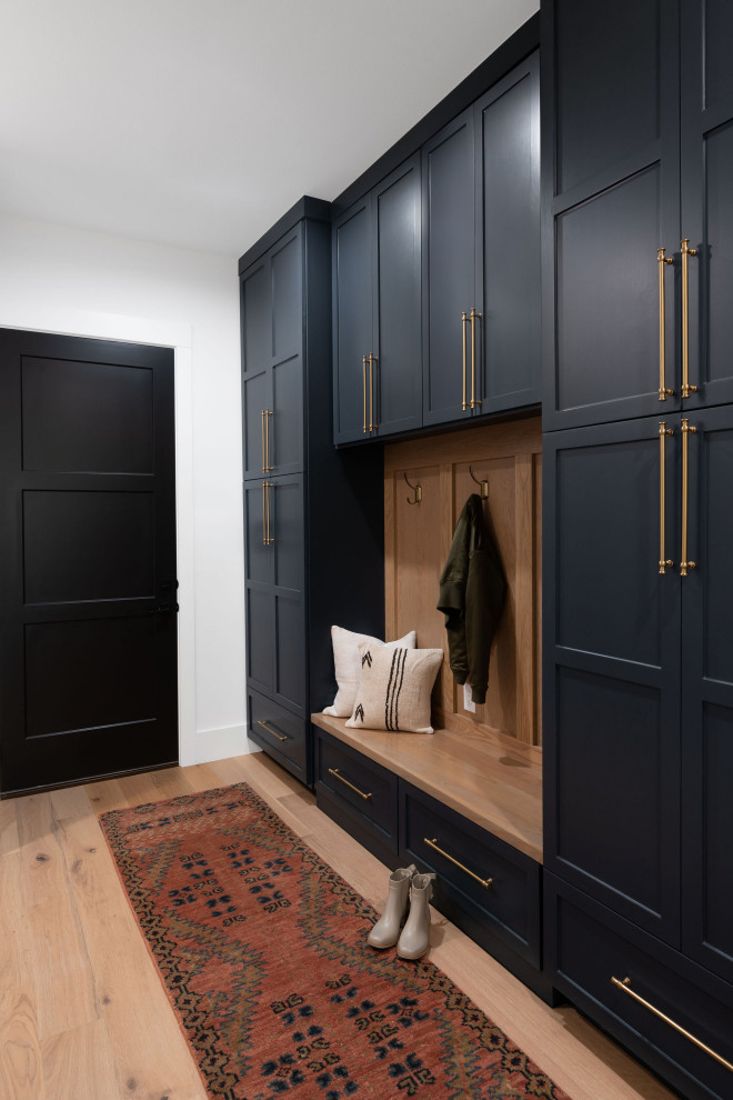 Classic Modern - Example of a transitional entryway design in Austin