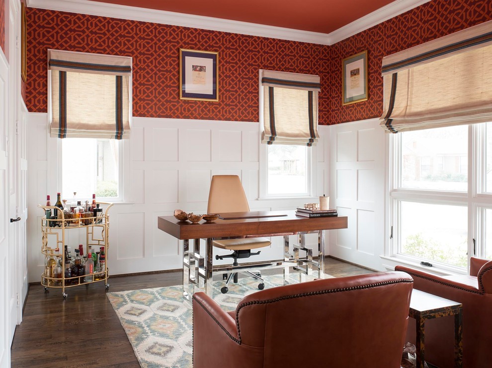 Transitional study room in Dallas with red walls, dark hardwood floors and a freestanding desk.