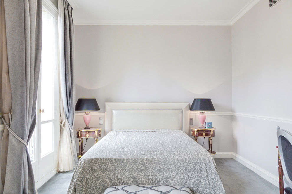Inspiration for a large transitional guest bedroom in Paris with grey walls and carpet.