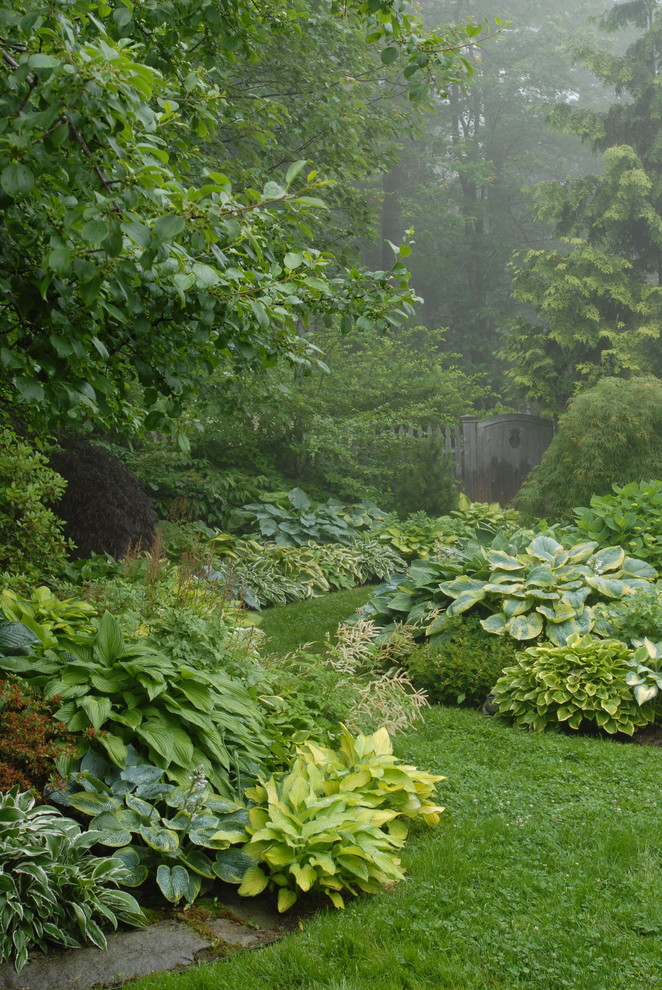 Inspiration for a traditional backyard shaded garden in Portland Maine with a garden path.