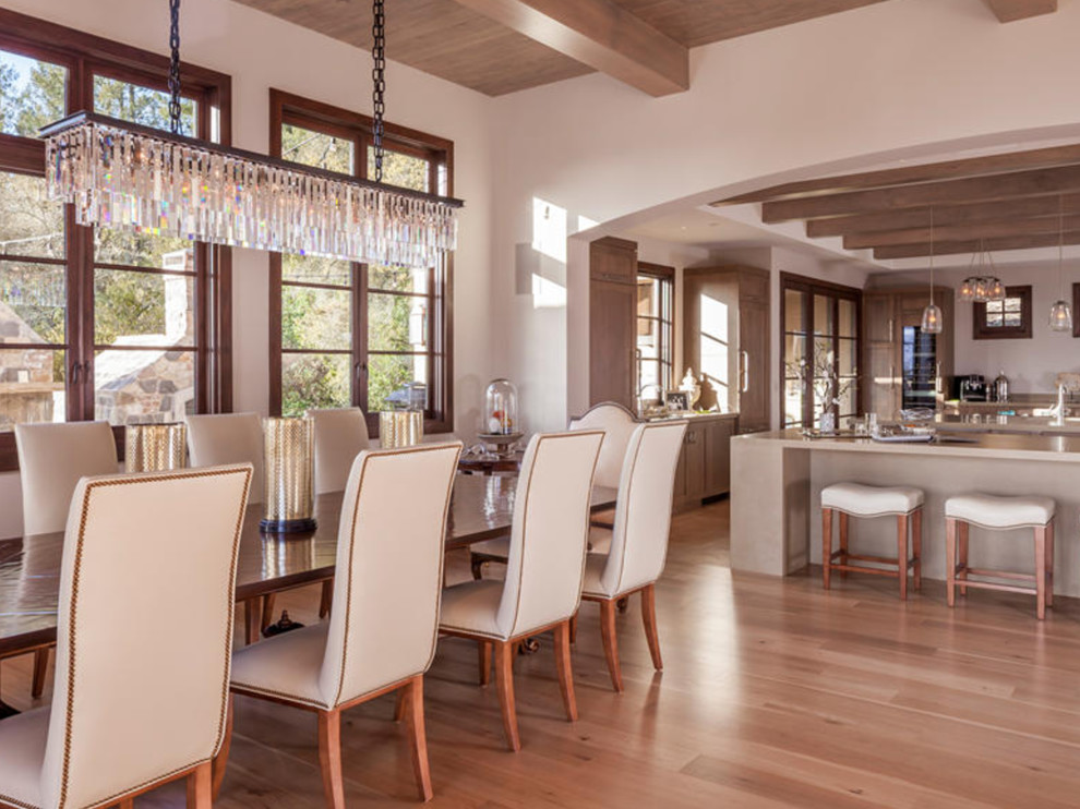 Photo of a large transitional kitchen/dining combo in San Francisco with travertine floors.