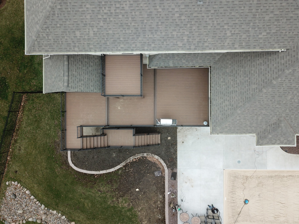 Deck - large backyard second story metal railing deck idea with no cover