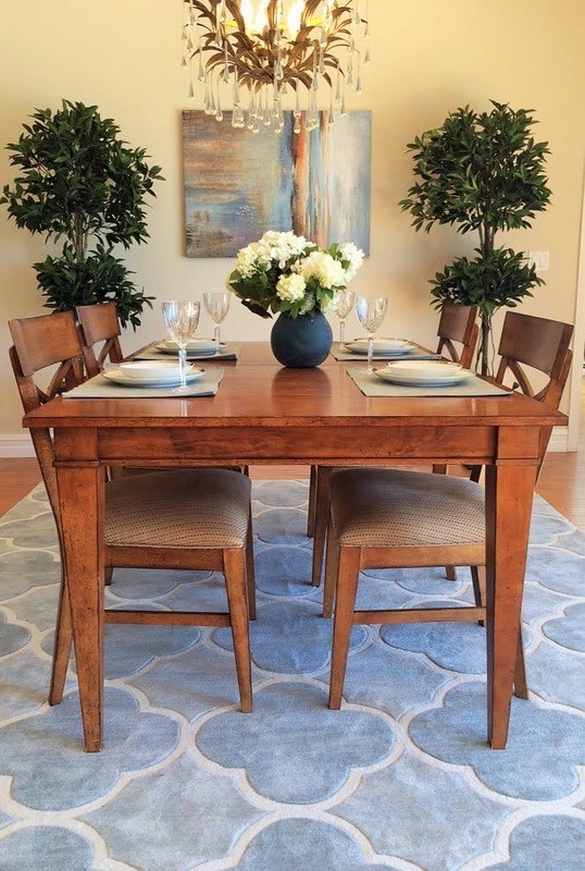 This is an example of a mid-sized transitional dining room in San Diego with beige walls, medium hardwood floors and no fireplace.
