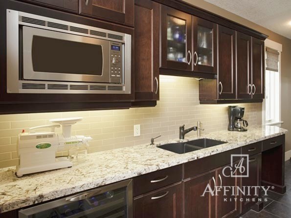 Inspiration for a mid-sized transitional ceramic tile eat-in kitchen remodel in Phoenix with a double-bowl sink, recessed-panel cabinets, dark wood cabinets, granite countertops, beige backsplash, subway tile backsplash and stainless steel appliances
