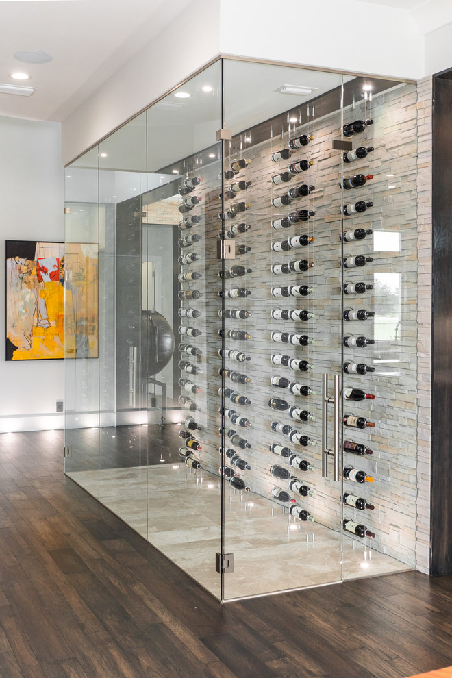 Design ideas for a small contemporary wine cellar in Tampa with beige floor and display racks.