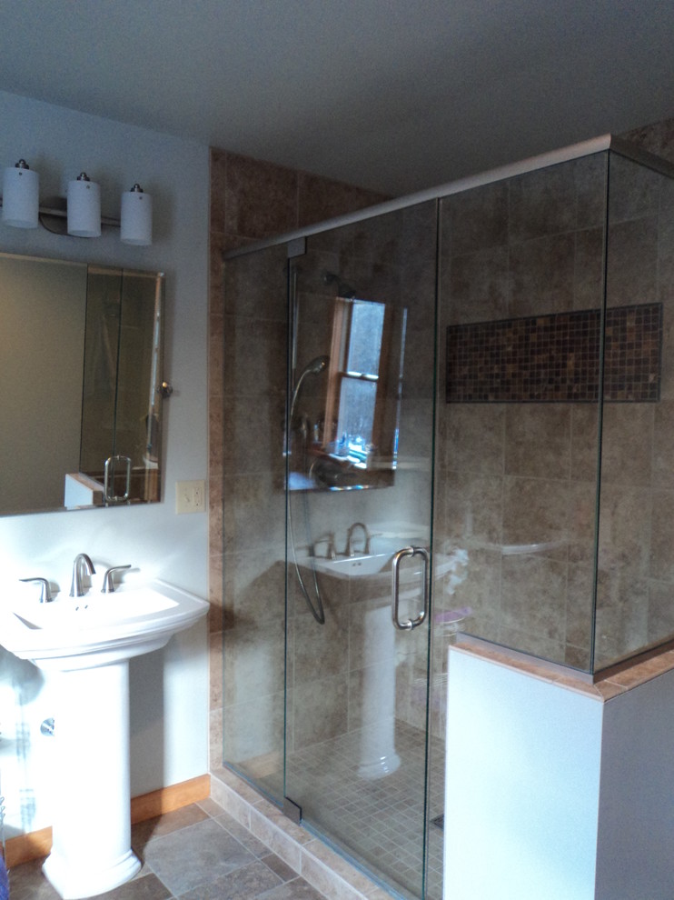 This is an example of a contemporary bathroom in Burlington with a pedestal sink and a two-piece toilet.