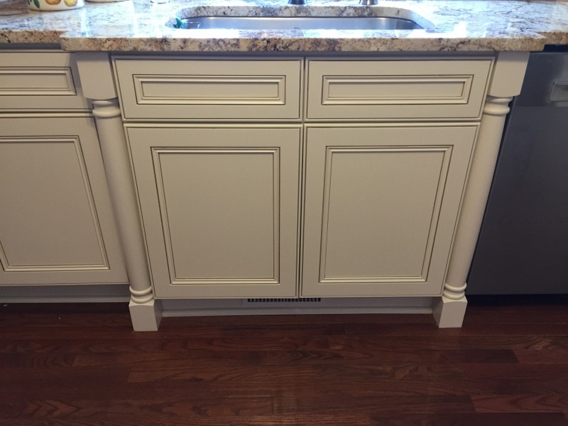 Example of a mid-sized transitional u-shaped medium tone wood floor eat-in kitchen design with an undermount sink, flat-panel cabinets, white cabinets, granite countertops, beige backsplash, stone tile backsplash, stainless steel appliances and a peninsula