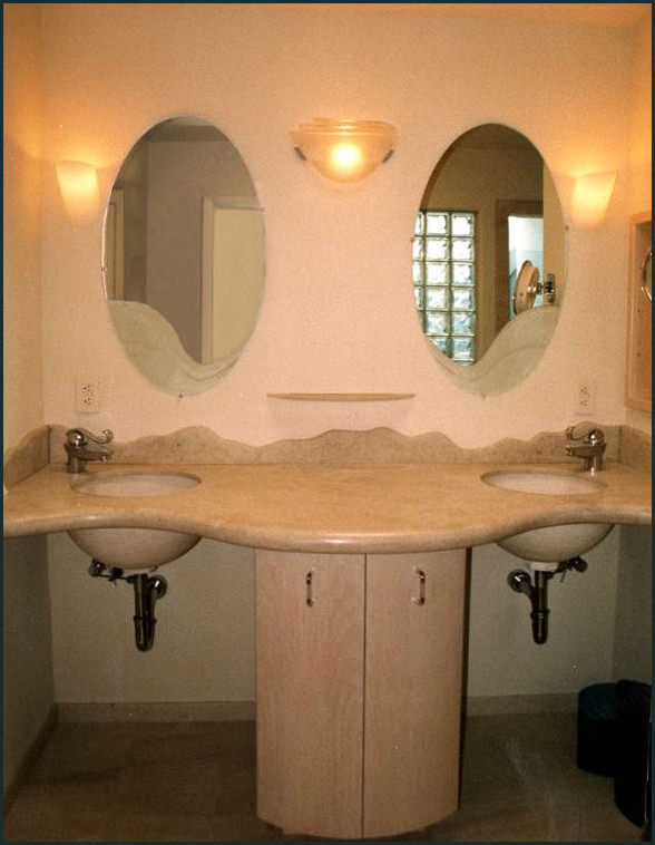 Inspiration for an expansive tropical master bathroom in San Francisco with an integrated sink, flat-panel cabinets, light wood cabinets, limestone benchtops, a hot tub, an open shower, a two-piece toilet, beige tile, stone tile, beige walls and limestone floors.