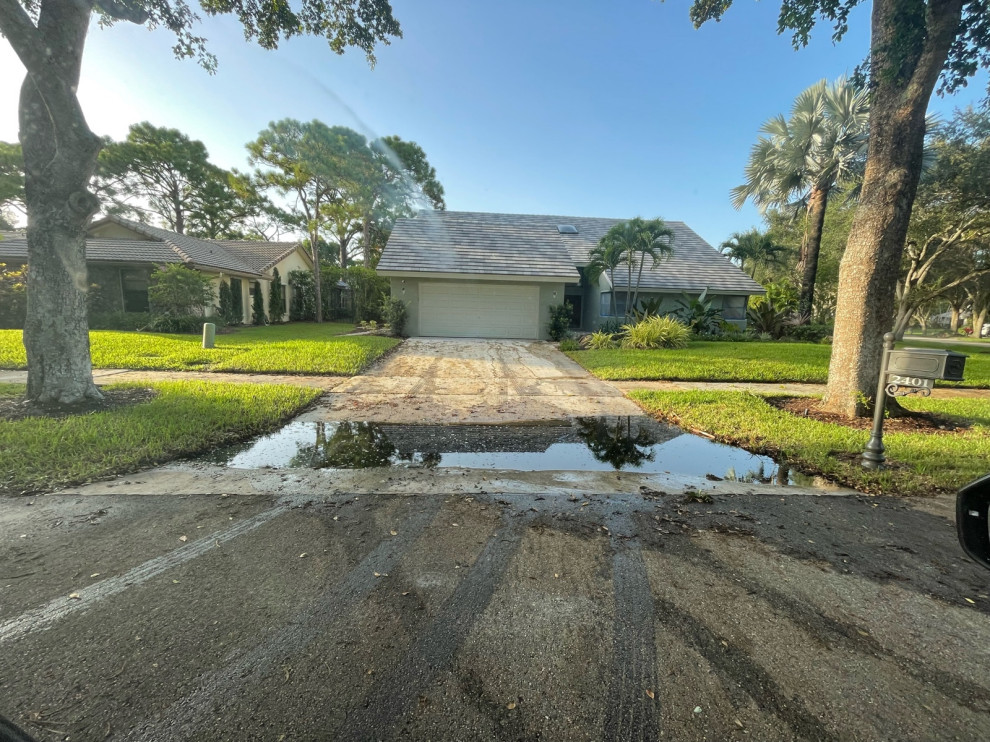 How to fix this? pooling water at end of driveway