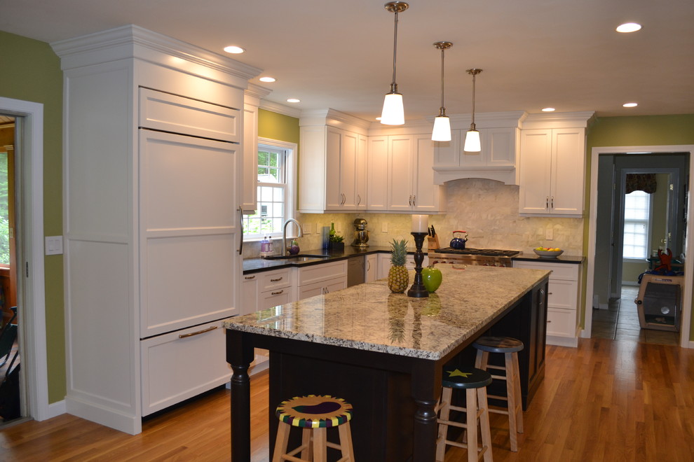 Design ideas for a large transitional l-shaped eat-in kitchen in Boston with an undermount sink, recessed-panel cabinets, white cabinets, granite benchtops, stainless steel appliances, light hardwood floors and with island.