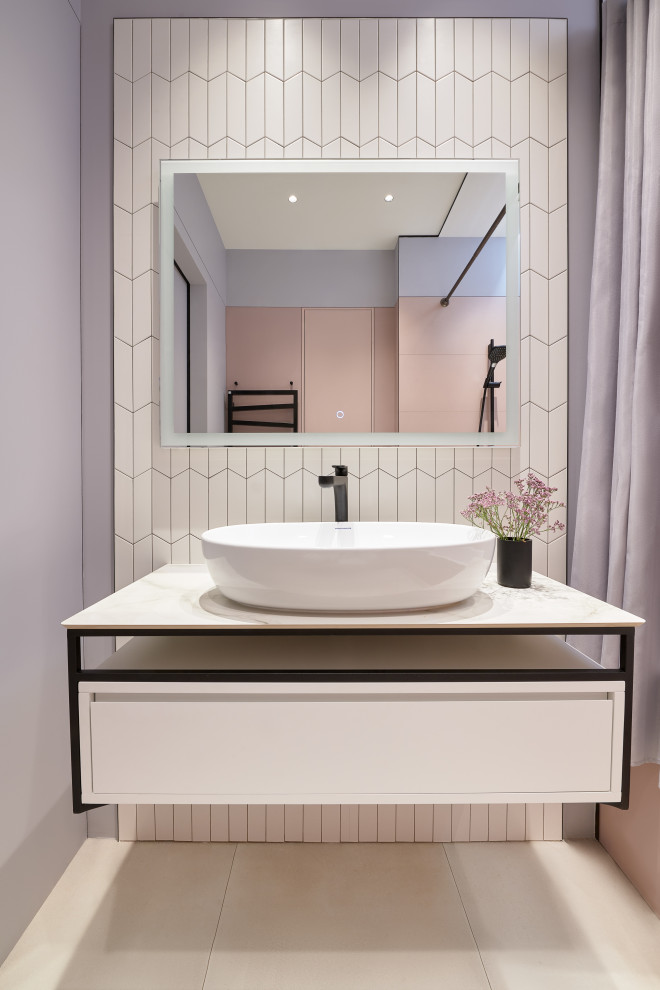 Design ideas for a small contemporary master bathroom in Moscow with flat-panel cabinets, white cabinets, an alcove tub, a wall-mount toilet, pink tile, porcelain tile, grey walls, porcelain floors, a drop-in sink, tile benchtops, grey floor, grey benchtops, a niche, a single vanity, a floating vanity and recessed.