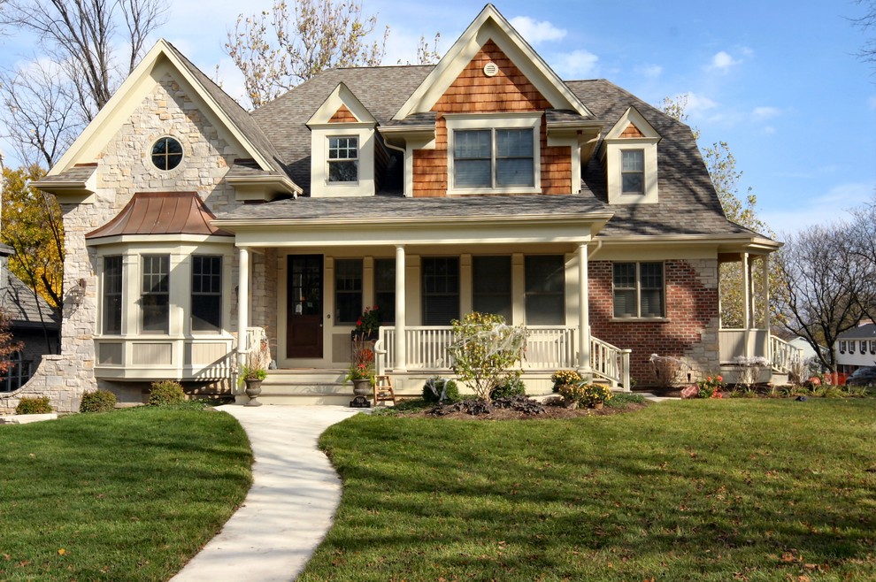 Design ideas for a mid-sized traditional two-storey beige exterior in Chicago.