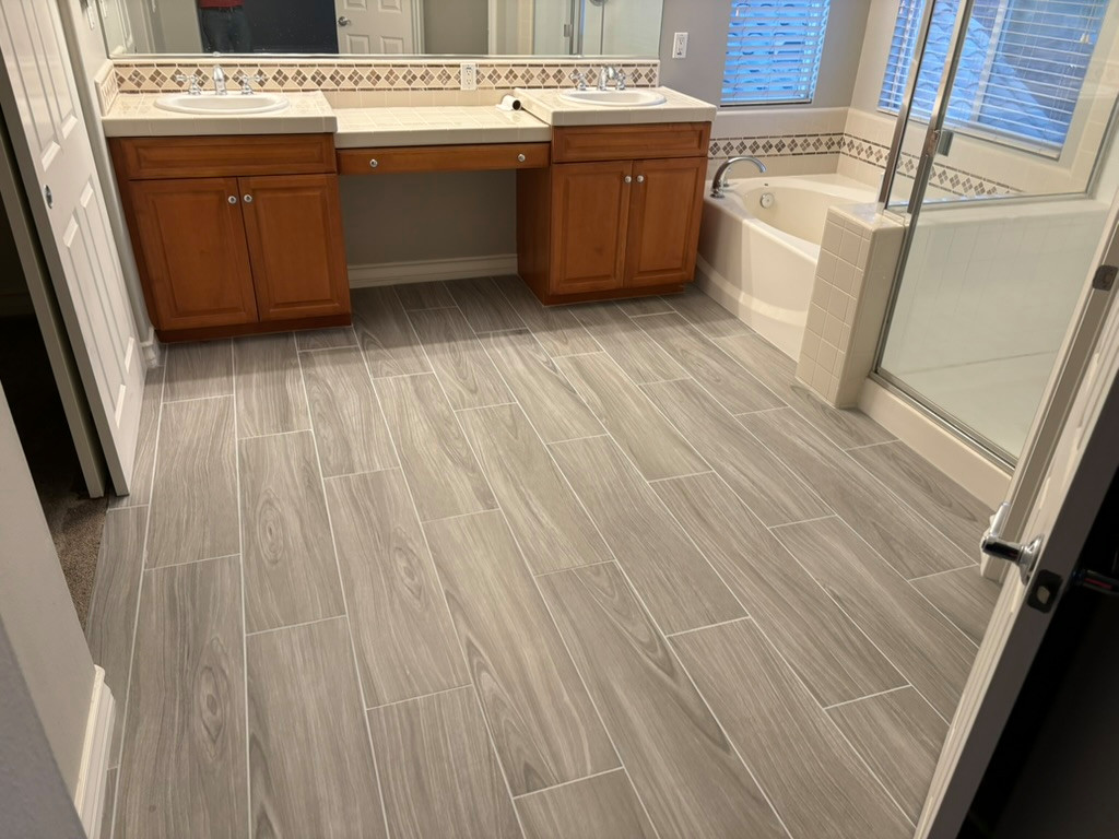 Tile plank install / laundry room cabinetry