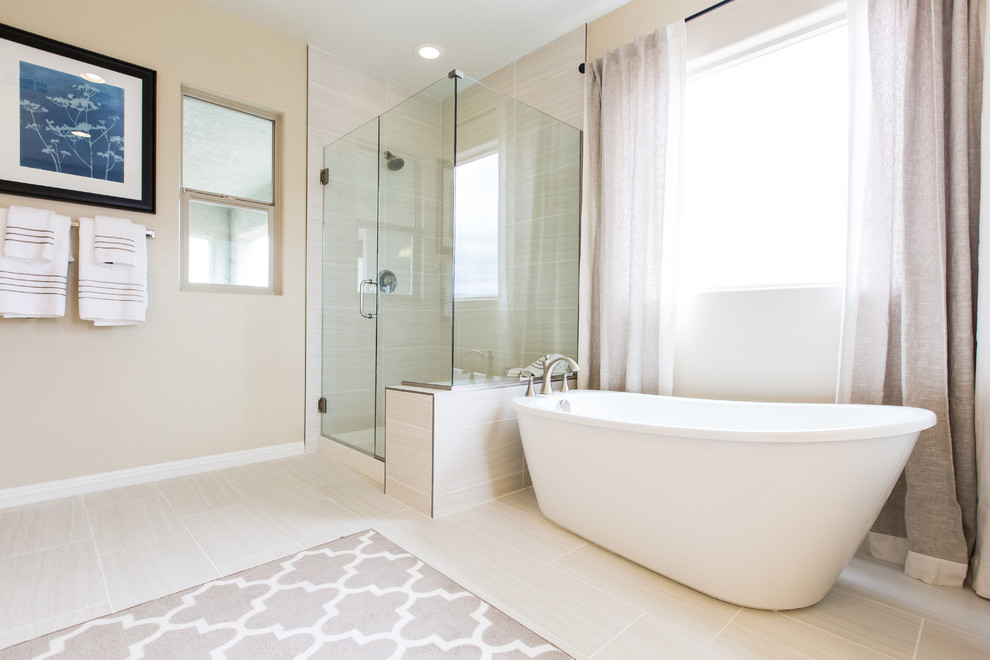 Design ideas for a large transitional master bathroom in Las Vegas with a freestanding tub and an alcove shower.