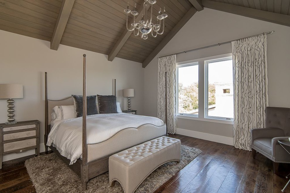 This is an example of a mid-sized transitional guest bedroom in Dallas with light hardwood floors.
