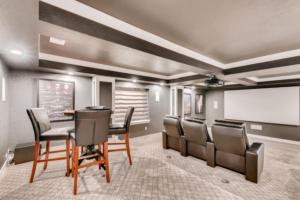 Photo of an expansive transitional walk-out basement in Denver with grey walls, carpet, multi-coloured floor and coffered.