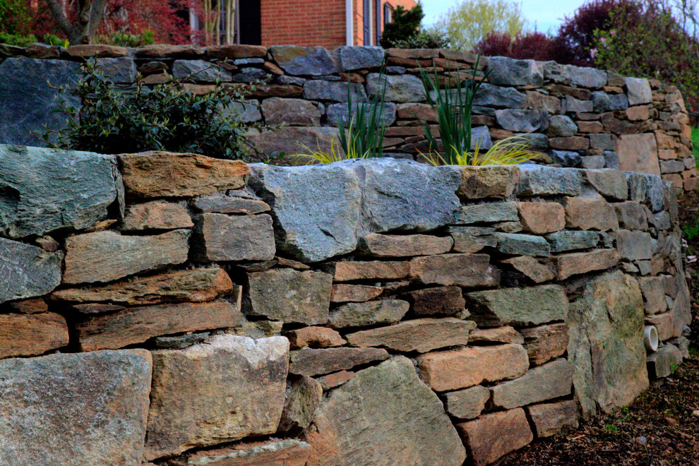 This is an example of a large front yard retaining wall landscape in DC Metro.