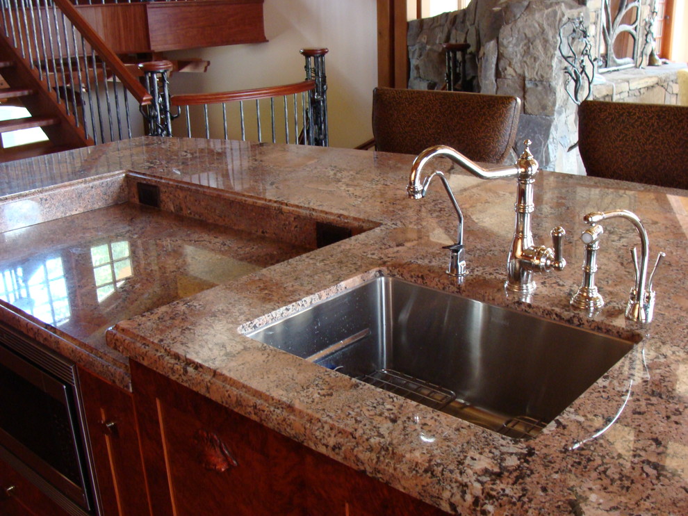 Example of a mountain style kitchen design in Calgary