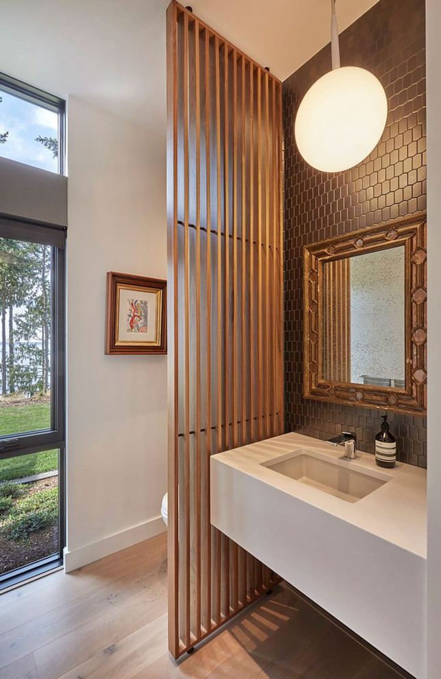 Example of a trendy powder room design in Seattle