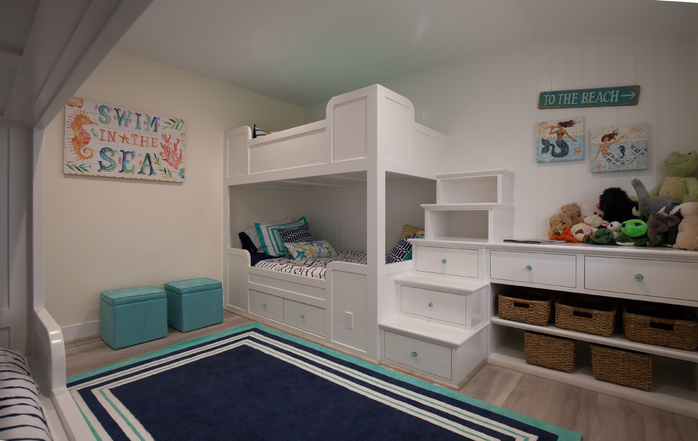 Inspiration for a mid-sized beach style kids' room in Los Angeles with light hardwood floors and white walls.