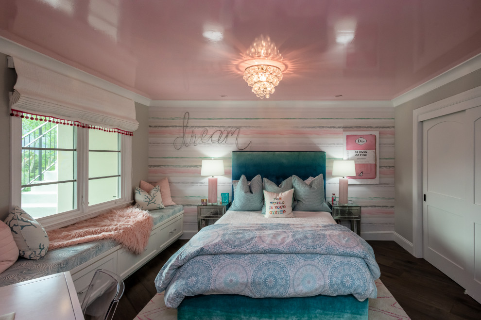 This is an example of a transitional kids' room for girls in San Francisco with multi-coloured walls, dark hardwood floors, brown floor and wallpaper.