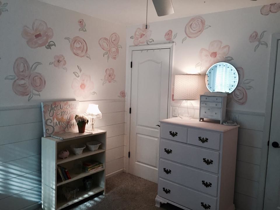 This is an example of a mid-sized traditional nursery for girls in Atlanta with white walls, carpet and beige floor.