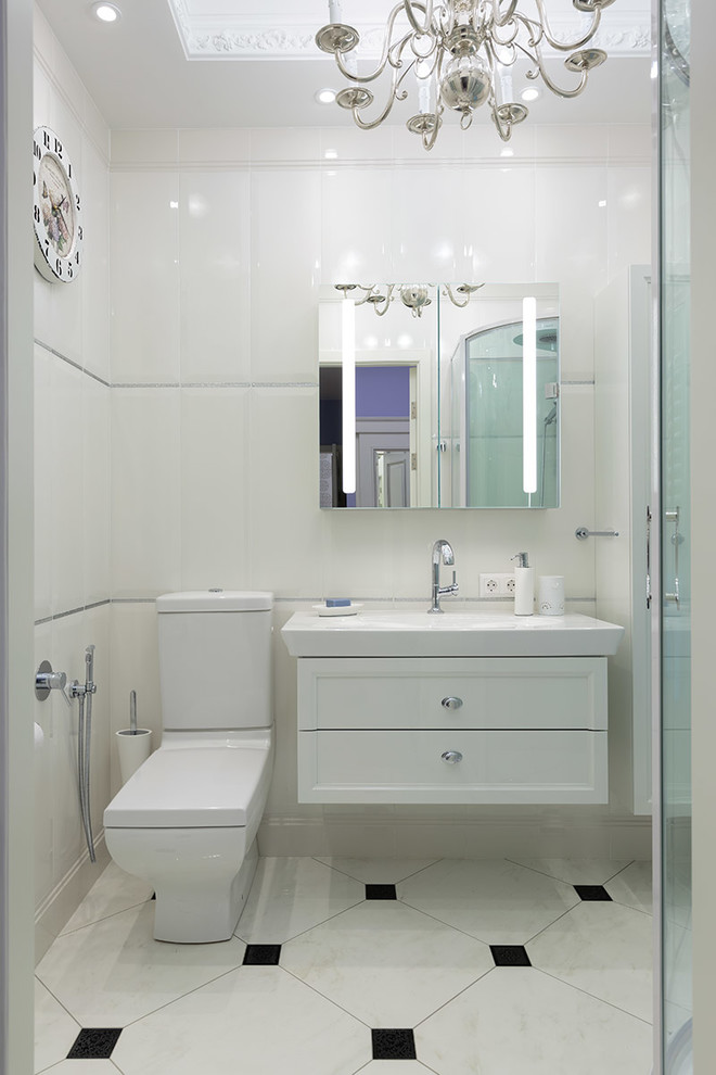 Photo of a small contemporary 3/4 bathroom in Saint Petersburg with recessed-panel cabinets, white cabinets, a two-piece toilet, an integrated sink, white floor, a corner shower, white tile, ceramic tile, white walls, ceramic floors and a sliding shower screen.
