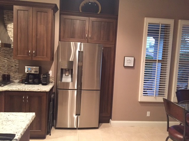 Open concept kitchen - mid-sized transitional l-shaped limestone floor and beige floor open concept kitchen idea with an undermount sink, shaker cabinets, dark wood cabinets, granite countertops, multicolored backsplash, matchstick tile backsplash, stainless steel appliances and an island