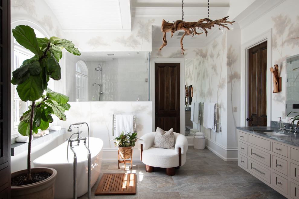 Example of a huge transitional master white tile and ceramic tile porcelain tile, multicolored floor, double-sink, vaulted ceiling and wallpaper freestanding bathtub design in Nashville with beaded inset cabinets, dark wood cabinets, a one-piece toilet, white walls, an undermount sink, soapstone countertops, a hinged shower door, black countertops and a floating vanity