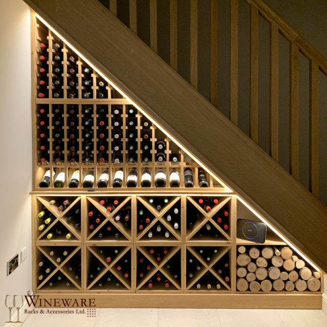 Solid pine under stairs wine storage in Audlem, Cheshire Contemporary