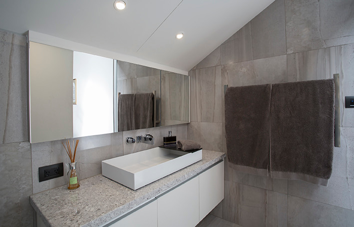 Design ideas for a contemporary bathroom in Melbourne with porcelain floors and grey floor.