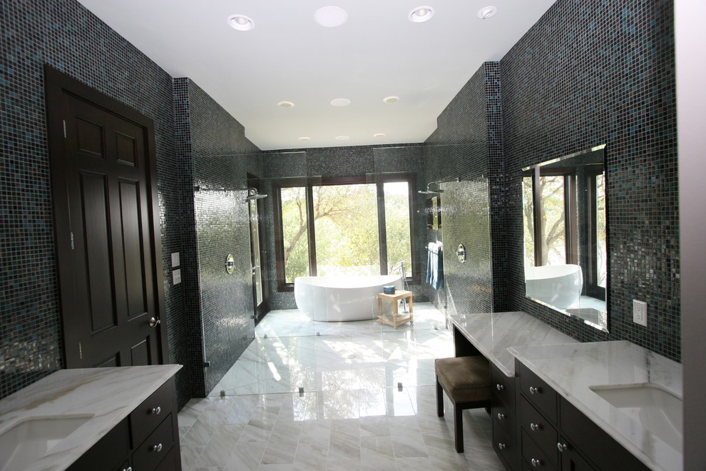 Large modern master bathroom in Dallas with flat-panel cabinets, black cabinets, a freestanding tub, a double shower, black tile, blue tile, multi-coloured tile, mosaic tile, multi-coloured walls, an undermount sink and granite benchtops.