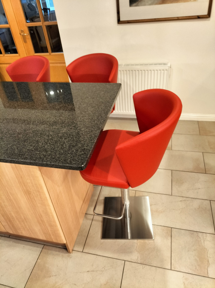 Medium sized contemporary u-shaped kitchen in Other with a breakfast bar.