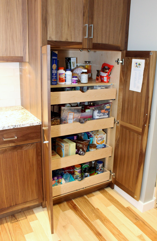 Inspiration for a mid-sized transitional l-shaped kitchen remodel with shaker cabinets, dark wood cabinets, ceramic backsplash, stainless steel appliances, an island and multicolored countertops