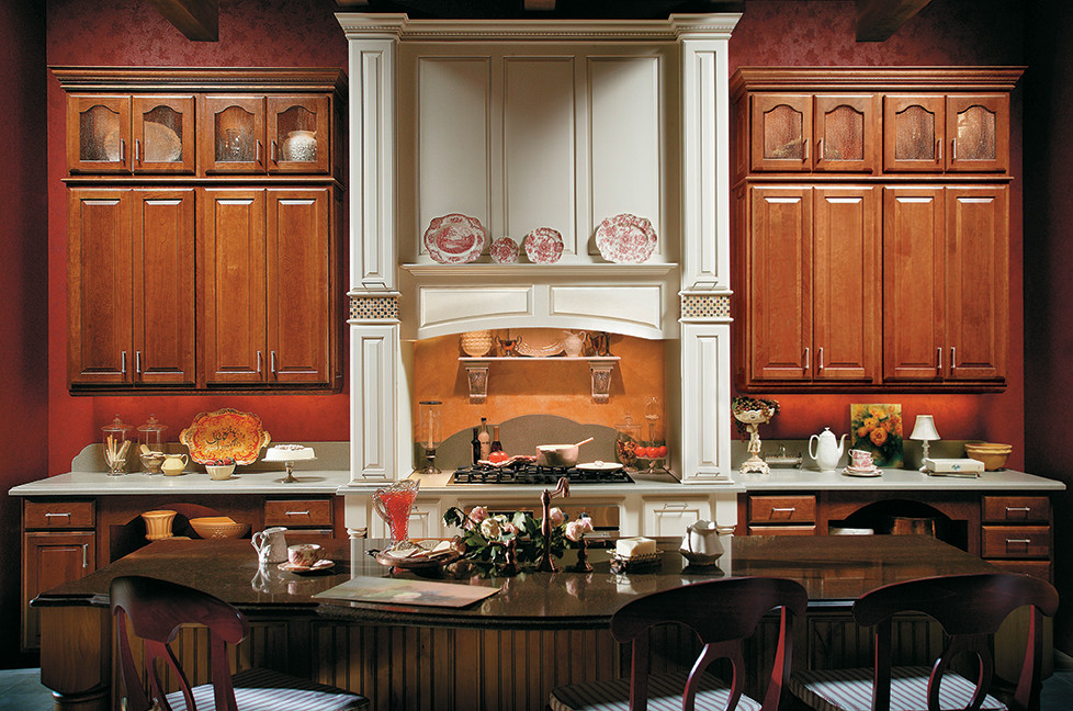 Example of a large transitional single-wall open concept kitchen design in Miami with raised-panel cabinets, medium tone wood cabinets, stainless steel appliances and an island