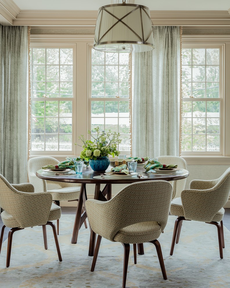 Inspiration for a traditional dining room in Boston with beige walls, carpet and beige floor.