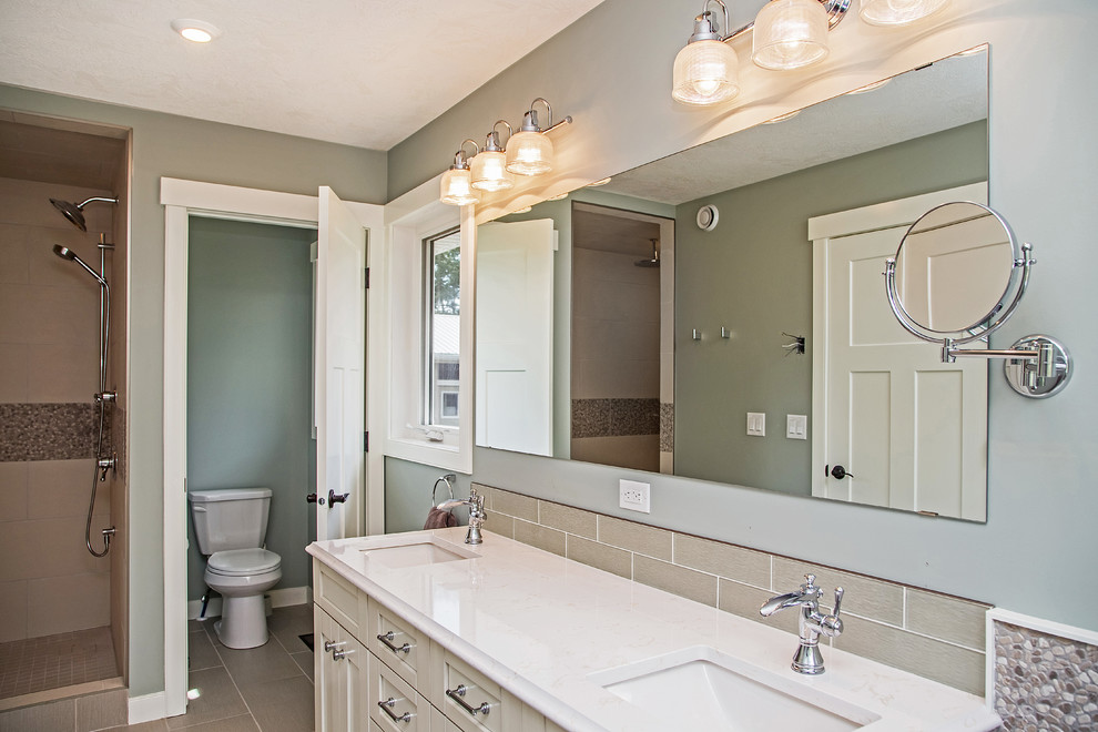 Inspiration for a mid-sized transitional master beige tile and porcelain tile porcelain tile freestanding bathtub remodel in Calgary with an undermount sink, shaker cabinets, white cabinets, quartz countertops and blue walls