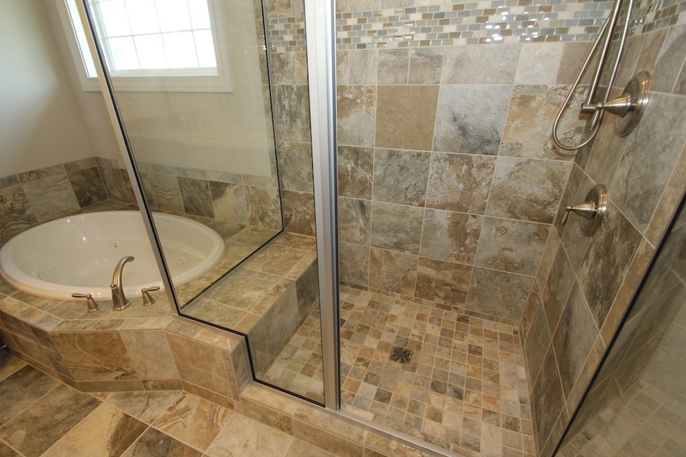 Drop-in bathtub - large transitional master multicolored tile and ceramic tile ceramic tile drop-in bathtub idea in Milwaukee with an undermount sink, medium tone wood cabinets, granite countertops, recessed-panel cabinets, a one-piece toilet and beige walls