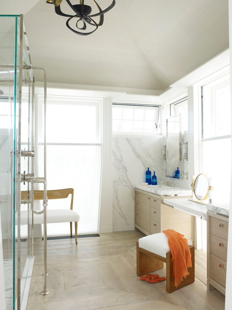 Inspiration for a contemporary bathroom remodel in New York with flat-panel cabinets and light wood cabinets