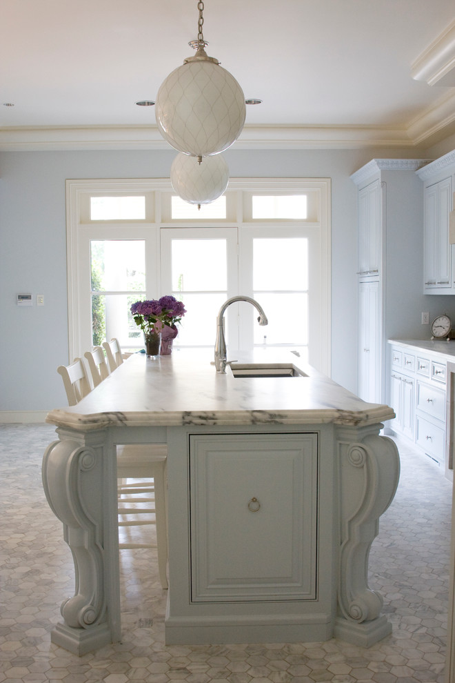 Photo of a traditional separate kitchen in Dallas with an undermount sink, raised-panel cabinets and white cabinets.