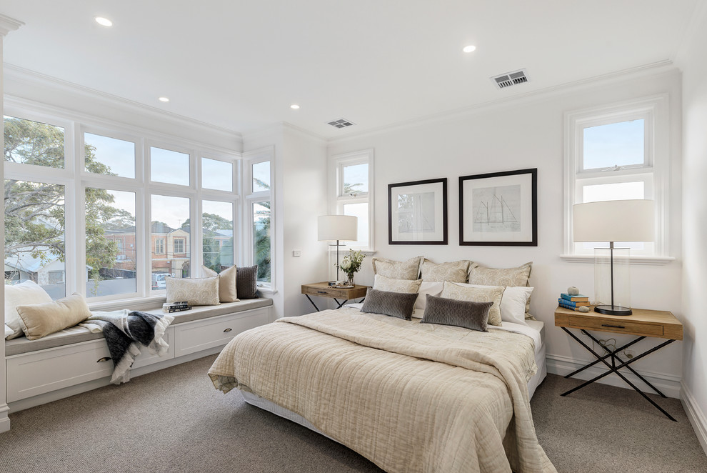 Design ideas for a beach style bedroom in Melbourne with white walls, carpet and grey floor.