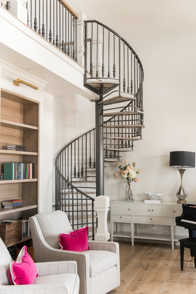 Photo of a mid-sized traditional metal spiral staircase in Salt Lake City with open risers and metal railing.