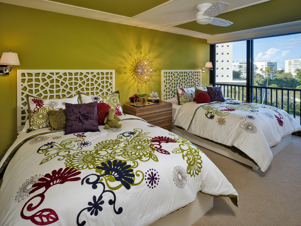 Beach style guest bedroom in Tampa with green walls and carpet.