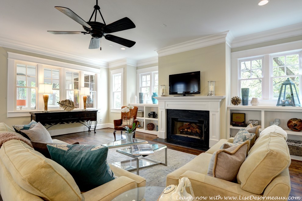 Design ideas for a large arts and crafts open concept family room in Atlanta with beige walls, medium hardwood floors, a standard fireplace, a stone fireplace surround and a wall-mounted tv.