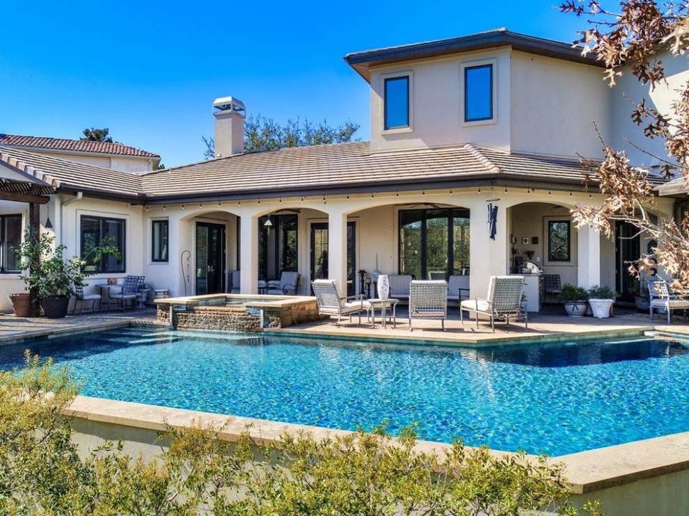 Transitional pool photo in Austin